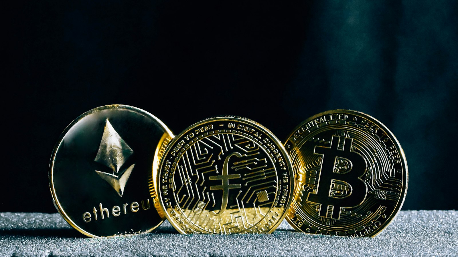 Ethereum and bitcoin coins on a table